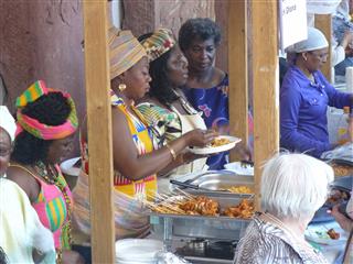 Selling ghanaian dishes at the International Pentecostal Festival.